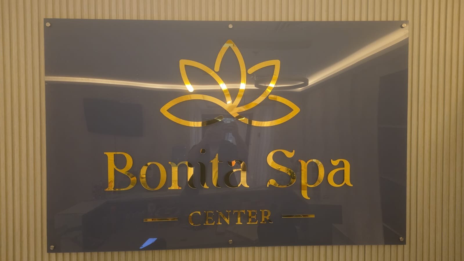 Bonita Spa Center reception, gold lotus signage
